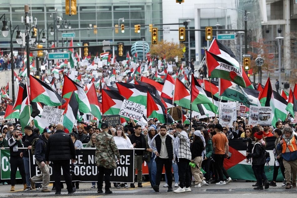 Thousands of people march down Washington Boulevard in downtown Detroit, Michigan, to call for a ceasefire and Palestinian liberation.