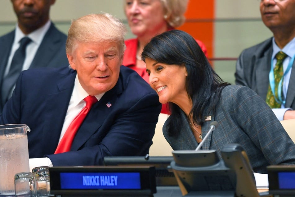 Donald Trump and US Ambassador to the United Nations Nikki Haley speaking during a meeting at the United Nations headquarters in New York on September 18, 2017.