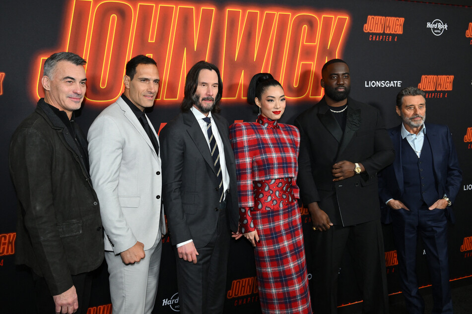 (From l to r:) Director Chad Stahelski and supporting cast members, Marko Zaror, Rina Sawayama, Shamier Anderson, and Ian McShanepose pose with Keanu Reeves (c) at the NYC special screening of John Wick: Chapter 4.