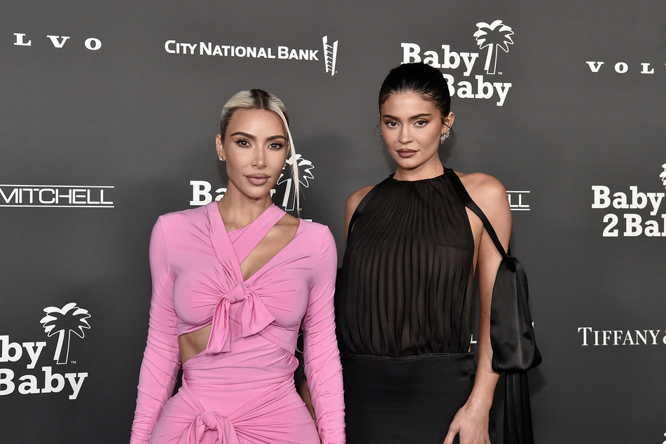 Kylie Jenner (r.) may soon be competing with older sister Kim with her very own fashion brand.