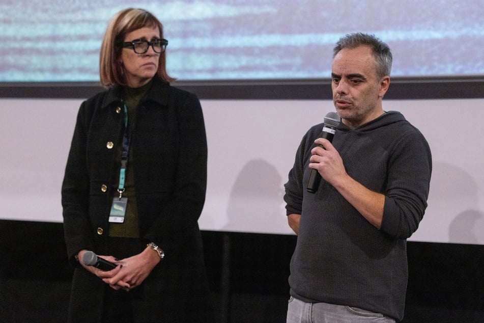 Director Joel Souza (r.) and cinematographer Bianca Cline (l.) stand on stage before the first screening of the Rust movie at the Camerimage Film Festival in Torun, Poland, on Wednesday.