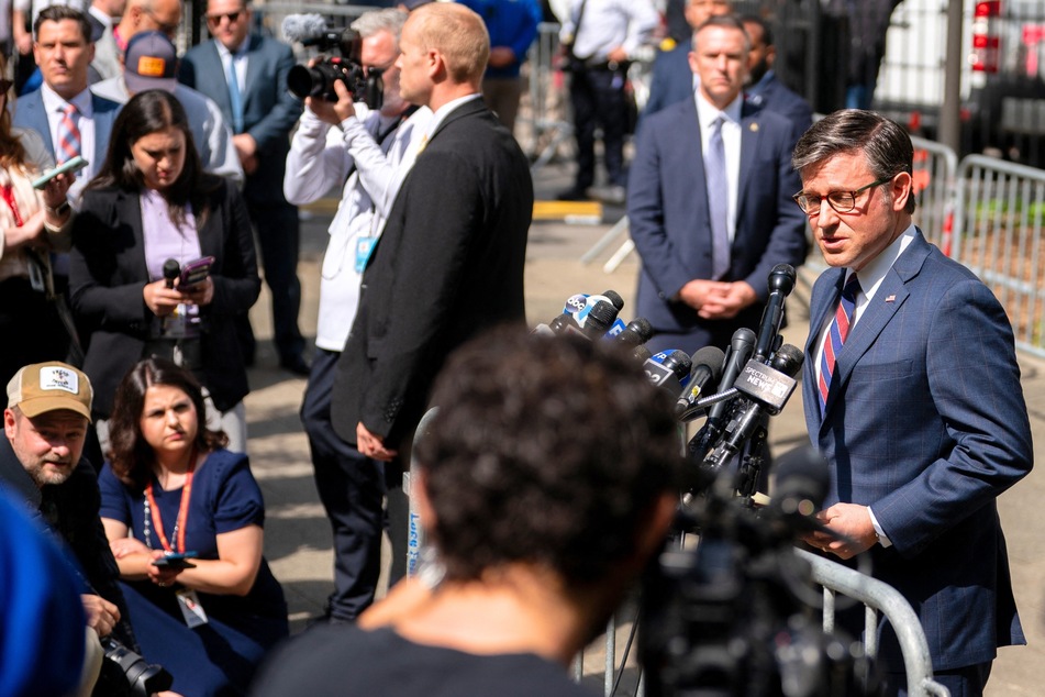 Speaker of the House Mike Johnson (r.) addressing the media outside of Donald Trump's criminal hush money trial in New York City on May 14, 2024.