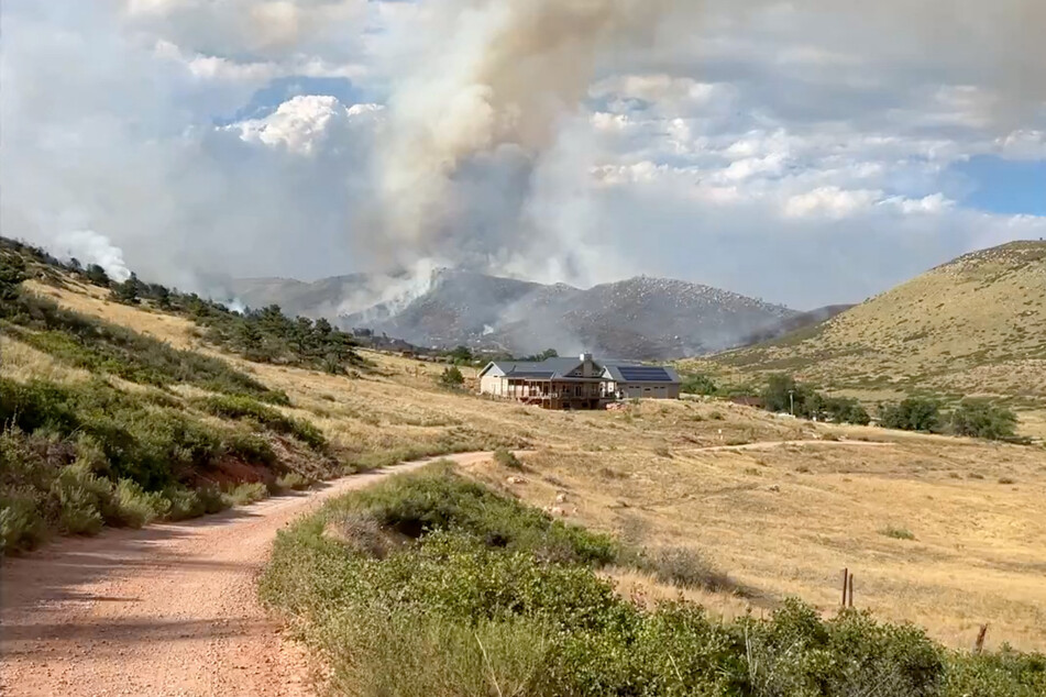 Smoke rises from the Stone Canyon fire near Lyons, Boulder County, Colorado.