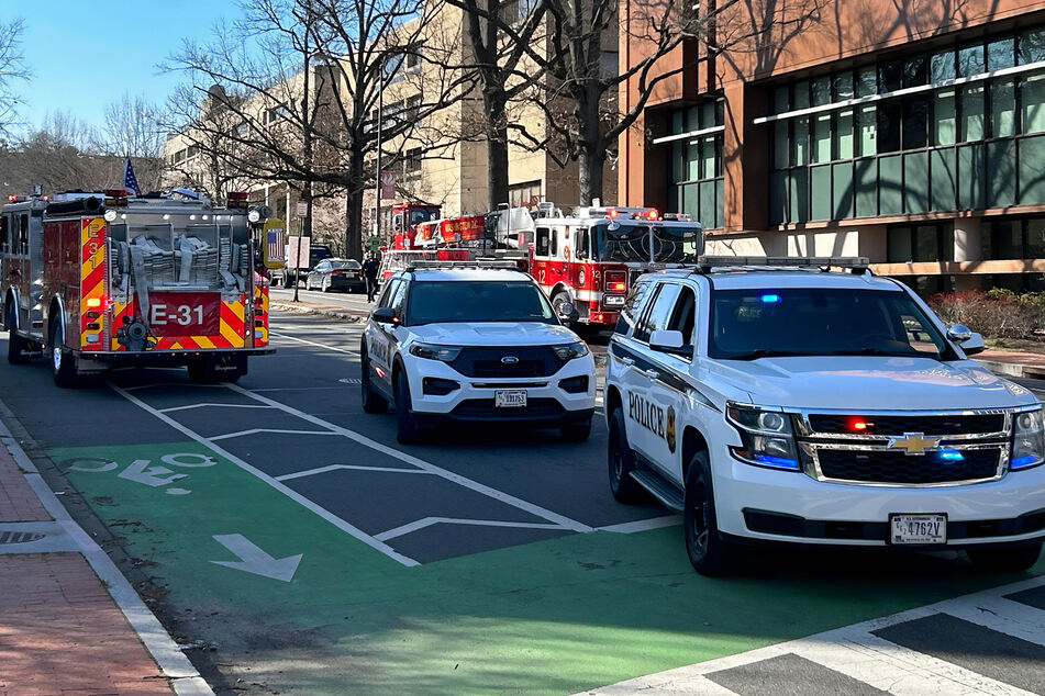 Emergency services at the scene in front of the Israeli embassy in Washington DC, where an active US Air Force member set himself on fire in protest at Israel's war on Gaza.