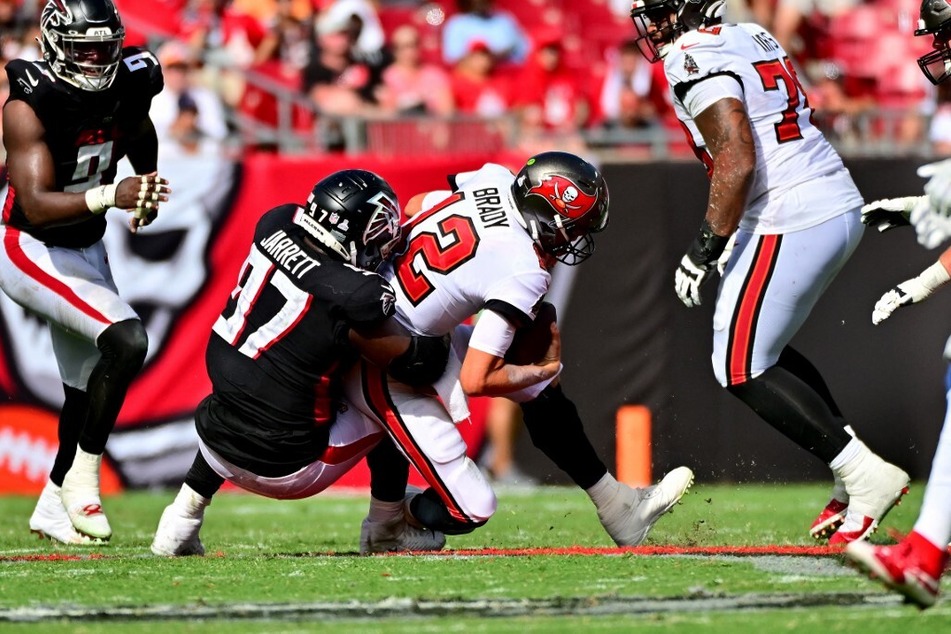 Grady Jarrett of the Atlanta Falcons sacked Tom Brady of the Tampa Bay Buccaneers and received a "roughing the passer" penalty during the fourth quarter of their game at Raymond James Stadium.
