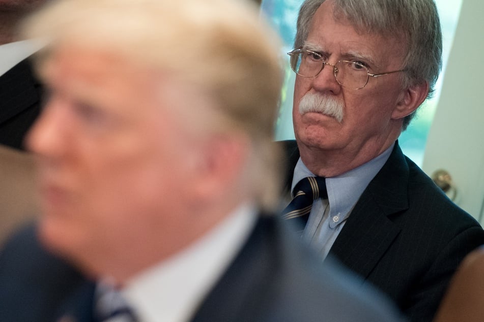 President Donald Trump (l.) speaks alongside National Security Adviser John Bolton (r.) during a Cabinet Meeting in the Cabinet Room of the White House in Washington, DC, May 9, 2018.