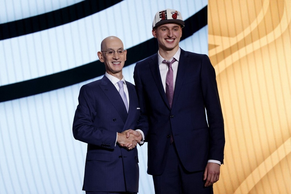 NBA commissioner Adam Silver (l) and Nikola Jovic pose for photos after Jovic was drafted with the 27th overall pick by the Miami Heat during the 2022 NBA Draft at Barclays Center