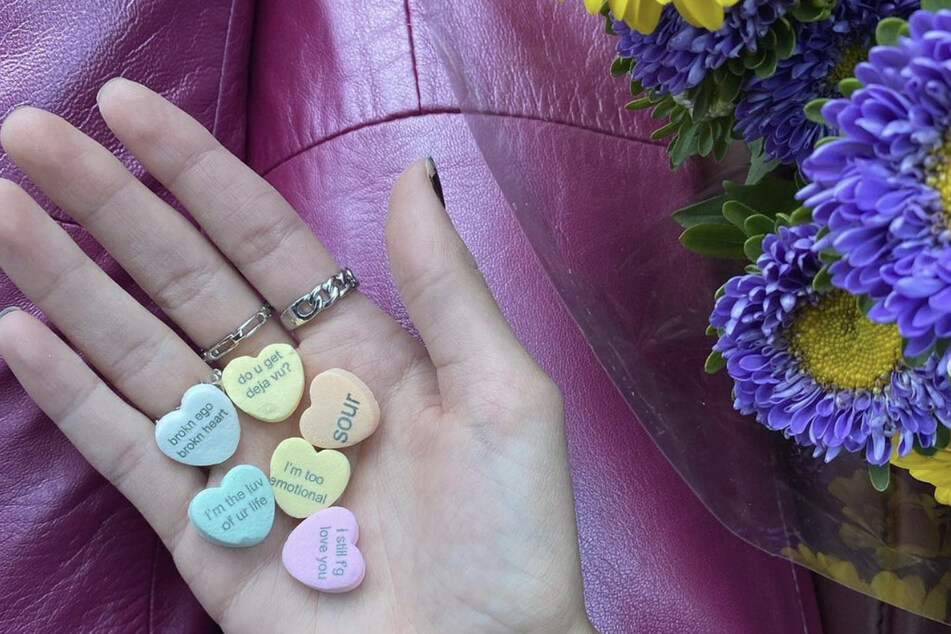 Olivia Rodrigo shows off customized Sweetheart candies featuring the names of several songs from SOUR.