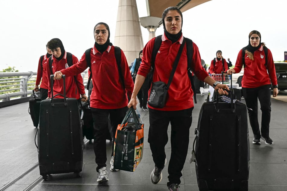 Members of Iran's women's soccer team arrived at the Kuala Lumpur International Airport in Sepang on Monday amid their journey home.