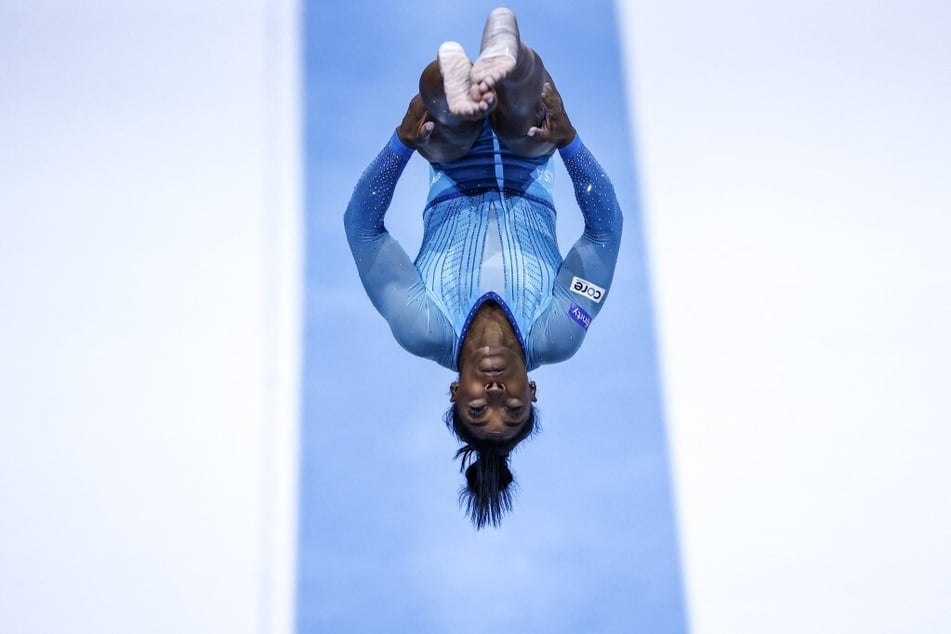 Simone Biles has become the first female athlete to land a Yurchenko double pike vault at the World Gymnastics Championships.