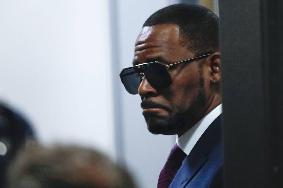 R. Kelly associate pleads guilty to trying to bribe witness