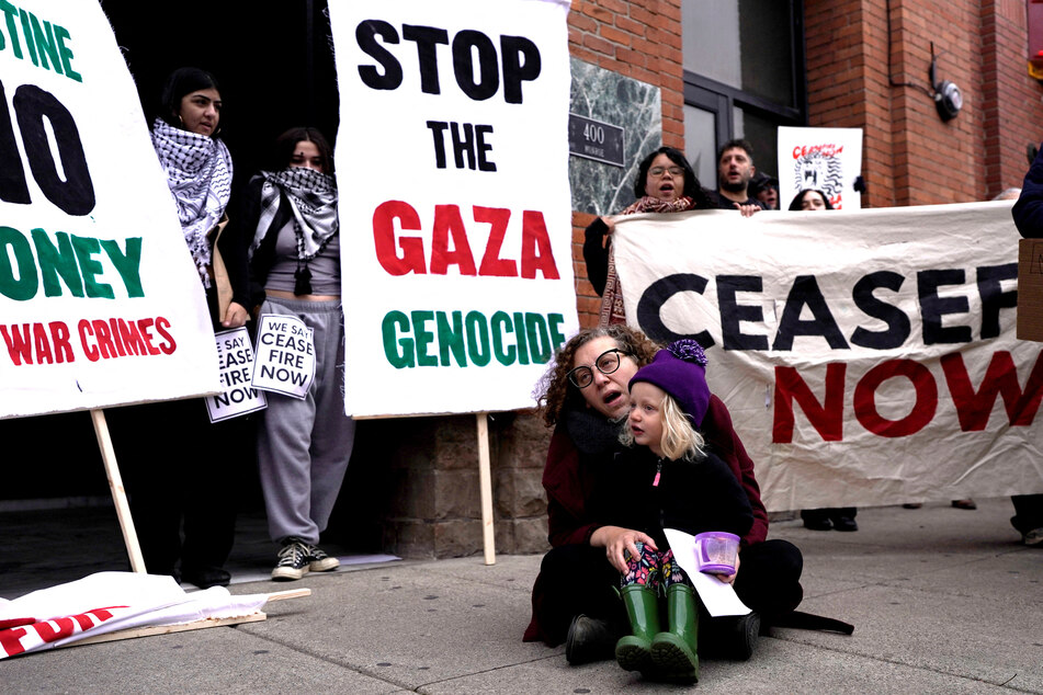 Members of Jewish Voice for Peace and allies rally in support of a ceasefire during a protest in Detroit, Michigan.
