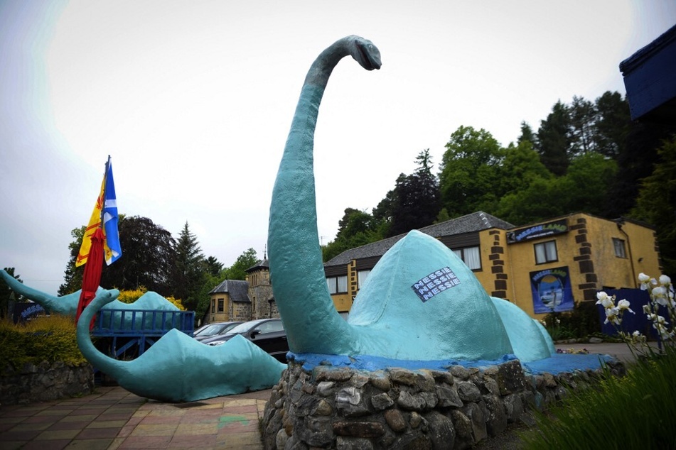 Statues of the Loch Ness Monster stand outside the Nessieland attraction in the Scottish Highlands.