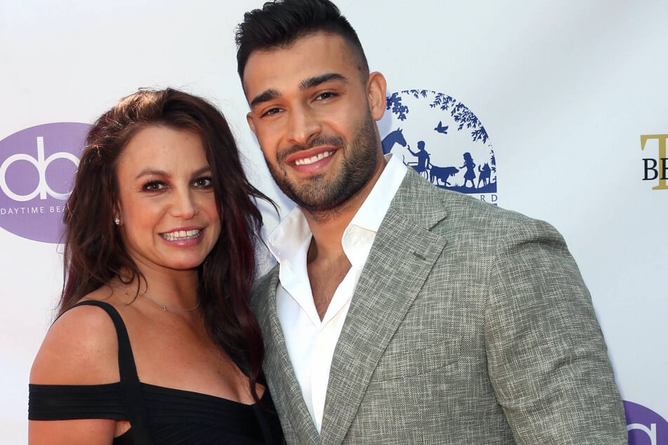 Britney Spears (l.) says the she married Sam Asghari (r.) as a "distraction" from the pain of being estranged from her two sons.