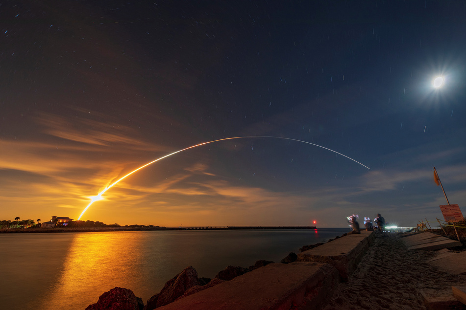 NASA's next-generation moon rocket, the Space Launch System rocket with the Orion crew capsule, lifts off from launch complex 39-B on the unmanned Artemis 1 mission to the moon, seen from Sebastian, Florida.