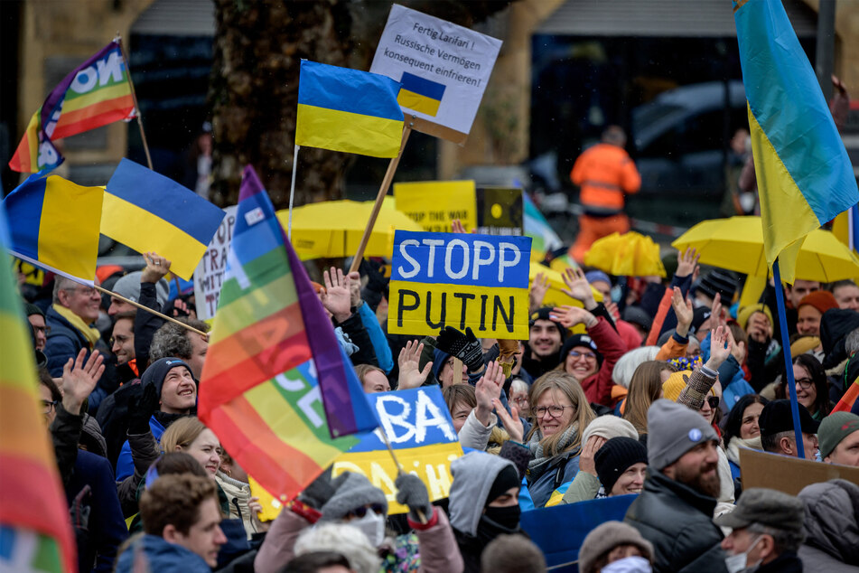 People protesting against Russia's extreme policies and the war in Ukraine.
