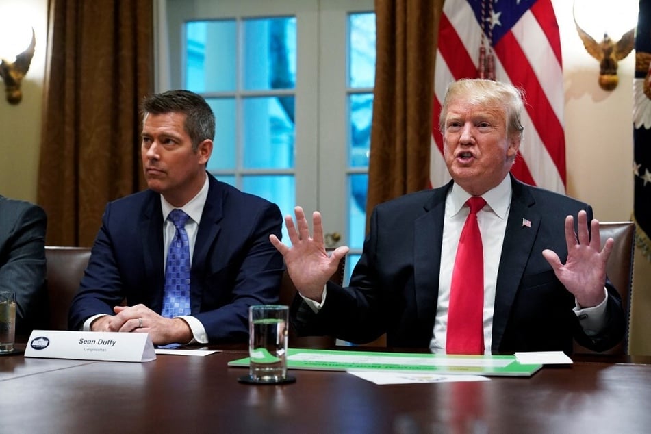 Then President Donald Trump (r.) sits with then Congressman Sean Duffy in the Cabinet Room of the White House on January 24, 2019.