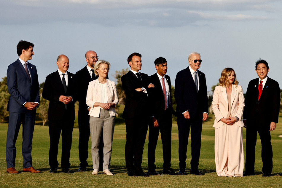 President Joe Biden and other G7 leaders watch a skydiving display in Savelletri, Italy.