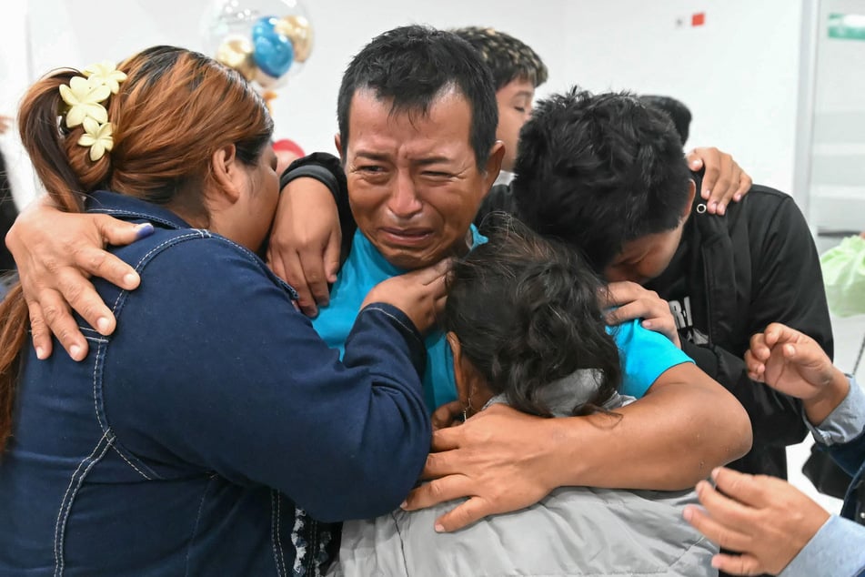 Don Maca crew member Oscar Marin hugs relatives upon his arrival at the Eloy Alfaro Manta international Airport in Ecuador on April 7, 2026.