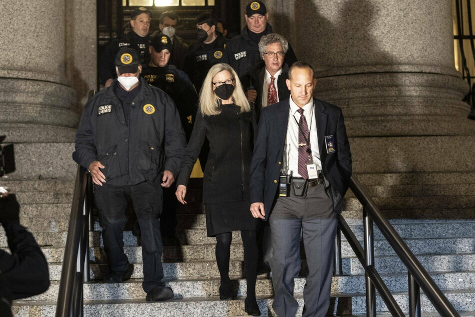 Defense attorneys Laura Menninger (c.) and Jeffrey Pagliuca (2nd from r.) leaving the Thurgood Marshall Courthouse in New York City.