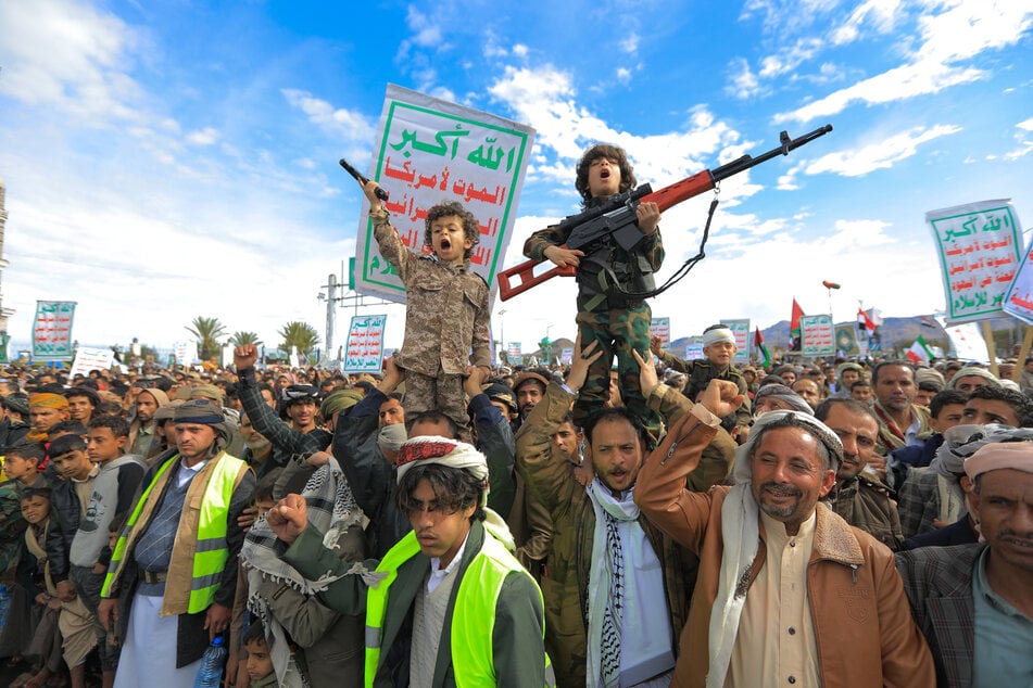 Young Houthi supporters hold weapons during a rally in solidarity with Iran and Lebanon, amid the US-Israeli war with Iran, in the Yemeni capital Sanaa on Friday.