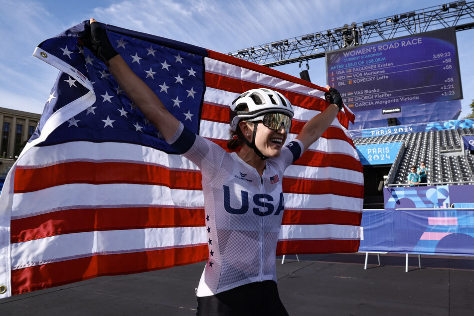 US' Kristen Faulkner celebrates her victory after winning the women's cycling road race during the Paris 2024 Olympic Games in Paris, on Sunday.