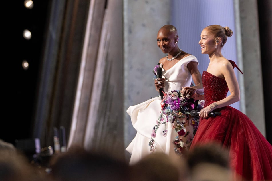 Ariana Grande (r.) revealed that she and her co-star Cynthia Erivo (l.) got matching hand tattoos to celebrate Wicked: For Good.