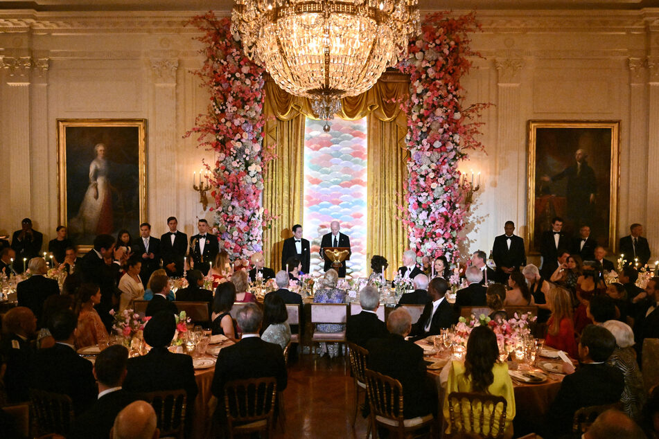 President Joe Biden speaks, flanked by Japanese Prime Minister Fumio Kishida, during a State Dinner in the East Room of the White House in Washington, DC, April 10, 2024.