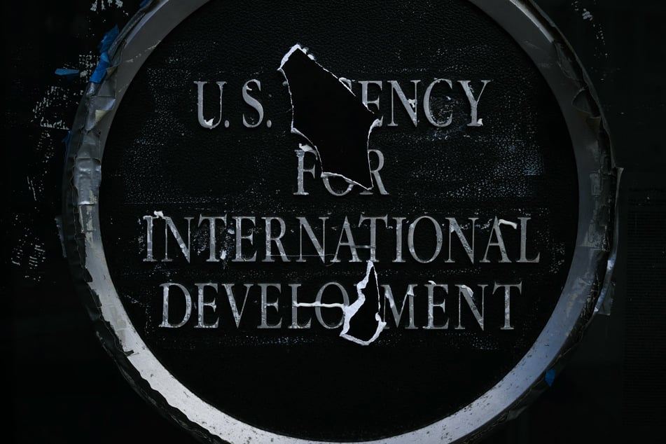 Remnants of signage for the US Agency for International Development is pictured on the facade of the Ronald Reagan Building and International Trade Center in Washington DC on December 29, 2025.