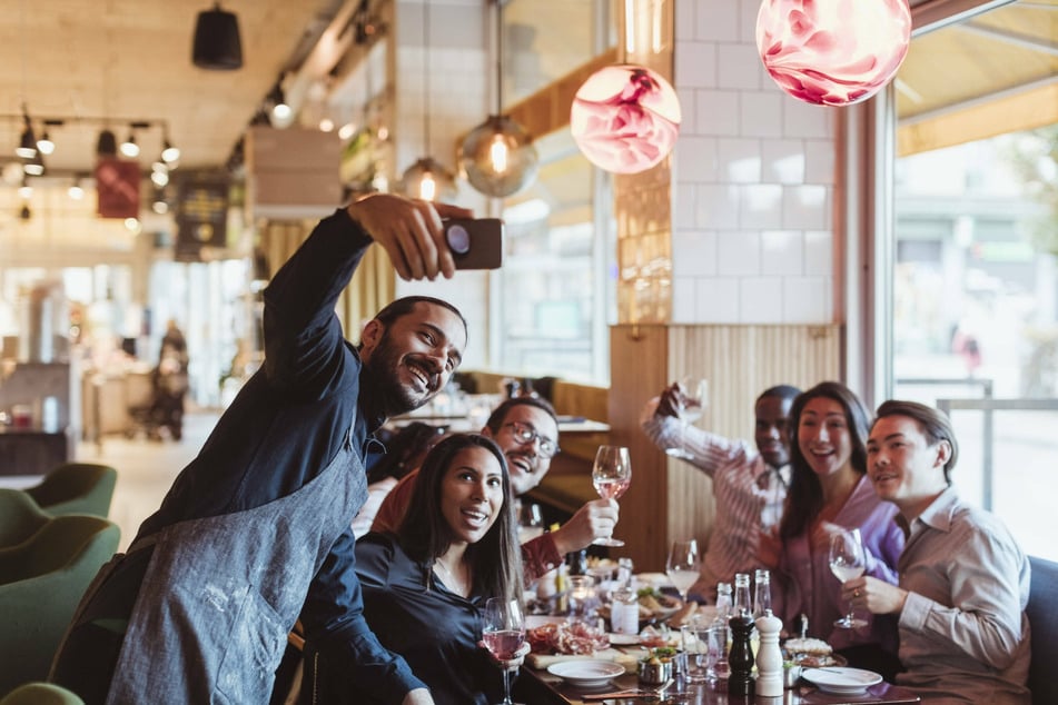 Is your server taking selfies with you and your friends? Perhaps they'd like you to have photos of them in your camera roll.