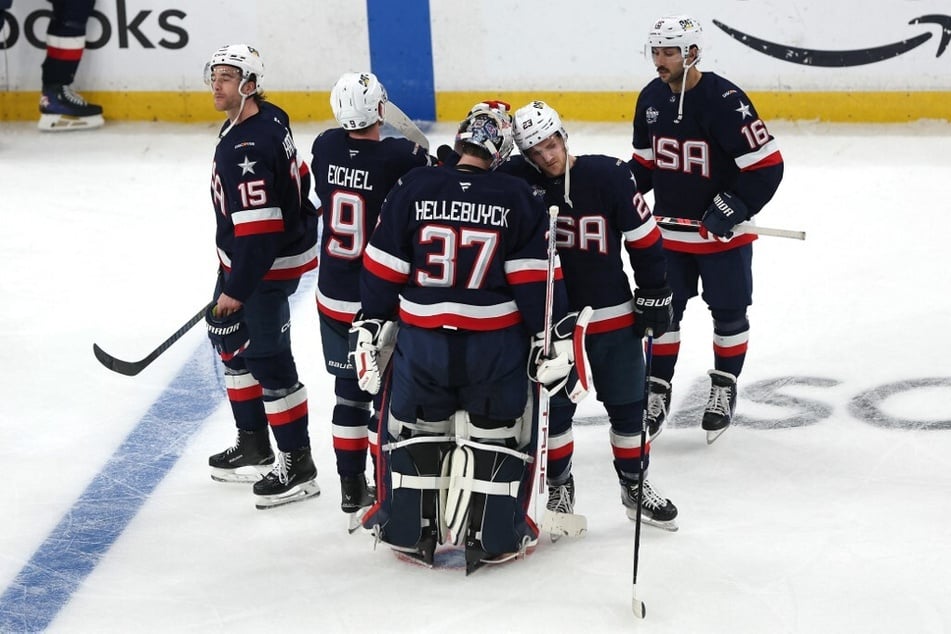 Team USA players react after being defeated by Team Canada in overtime in the NHL Four Nations Face-Off Championship Game.