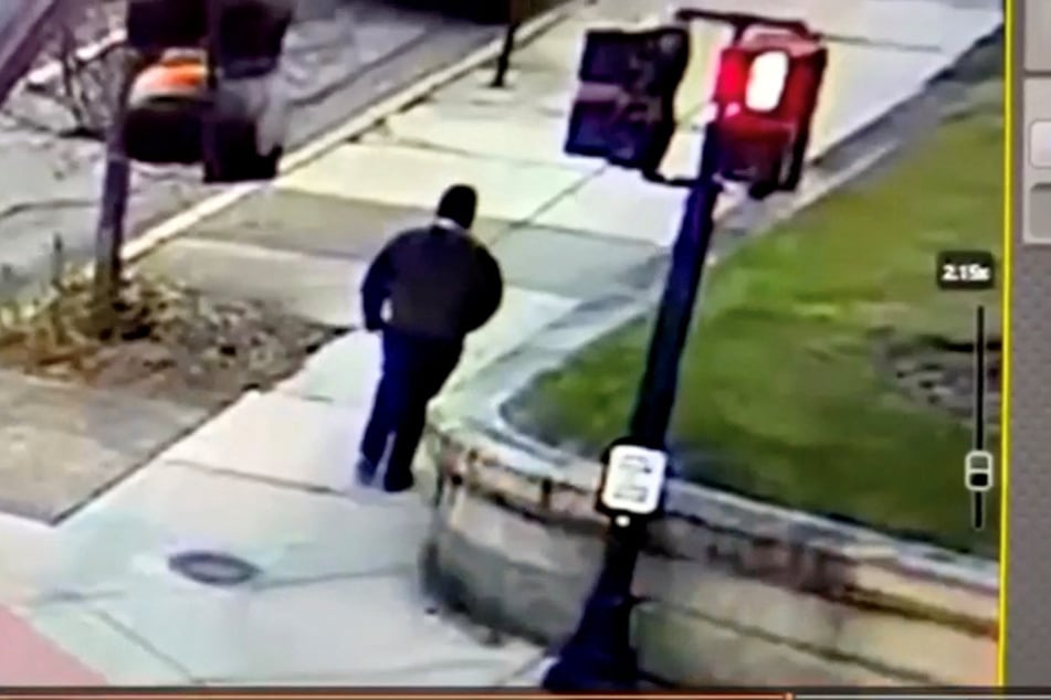 Police are still searching for the suspected gunman, who was caught on camera dressed in all black.