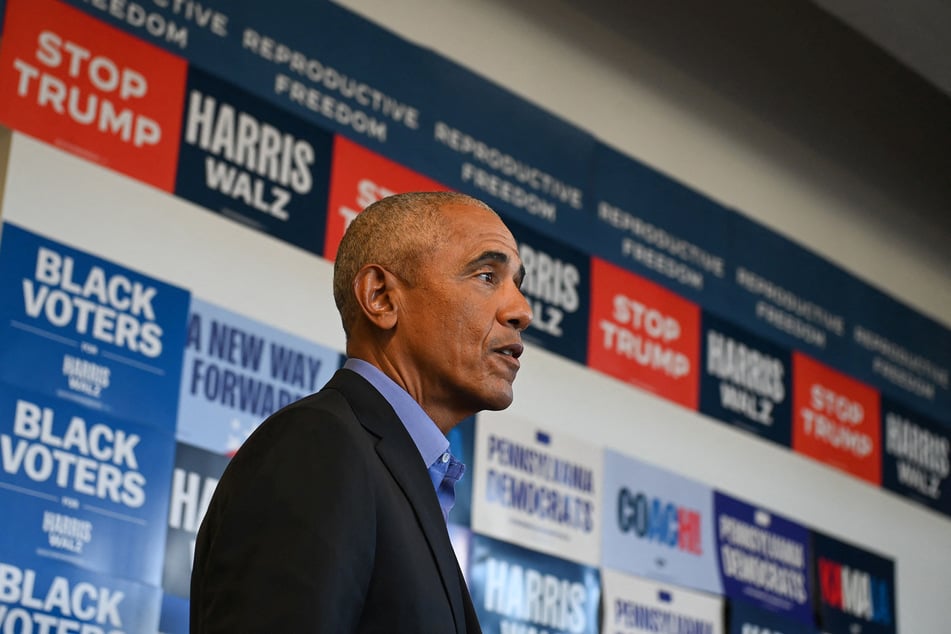 Former President Barack Obama talks to supporters at a campaign field office in East Liberty, ahead of a rally for Vice President Kamala Harris.