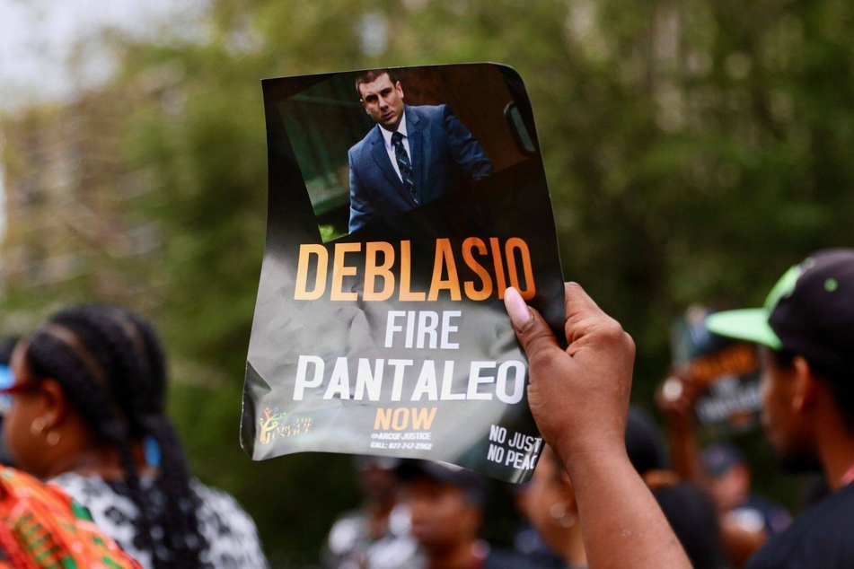 A protester outside of NYPD headquarters in 2019, calling for the firing of then-officer Daniel Pantaleo.