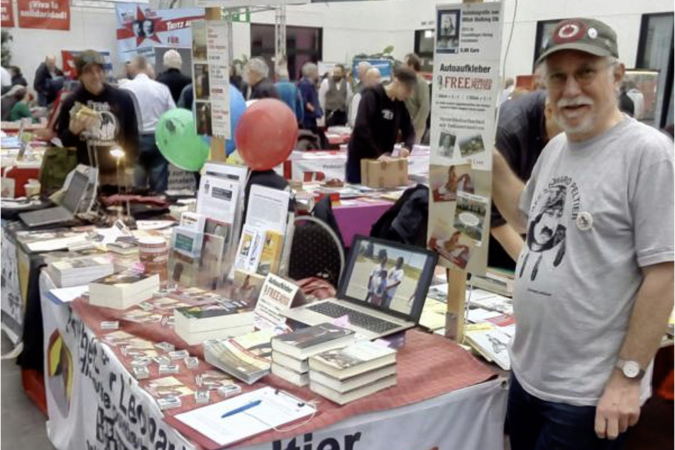 Holger Zimmer volunteers at a stand for Leonard Peltier at the annual Rosa Luxemburg Conference in Berlin, Germany.