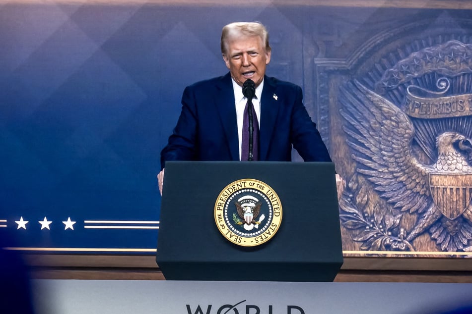 President Donald Trump told world business leaders Thursday to manufacture in the US or face tariffs.