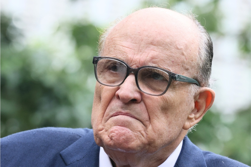 Former New York City Mayor Rudy Giuliani exited a 9/11 memorial event on Monday early.