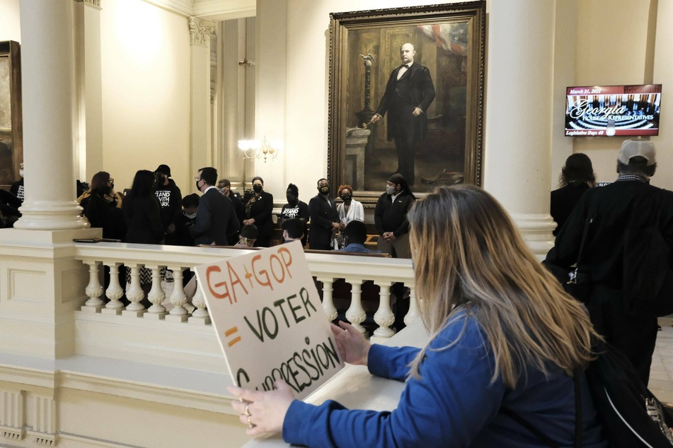 Protesters demonstrated inside the Georgia State Capitol building in March as the controversial voting bill was being signed into law.