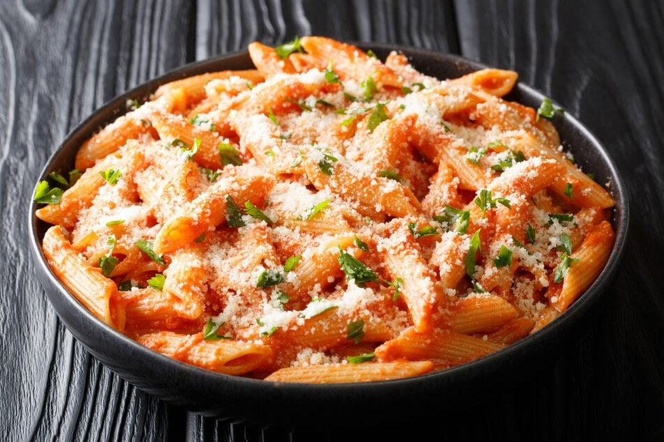 Penna alla Vodka is a pasta sauce made with crushed tomatoes, cream, and chili flakes.