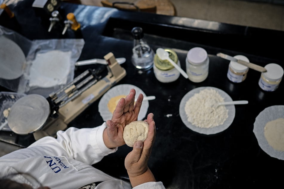 Dr. Raquel Gomez Pliego prepares tortilla dough at the Industrial Microbiology laboratory of the National Autonomous University of Mexico.