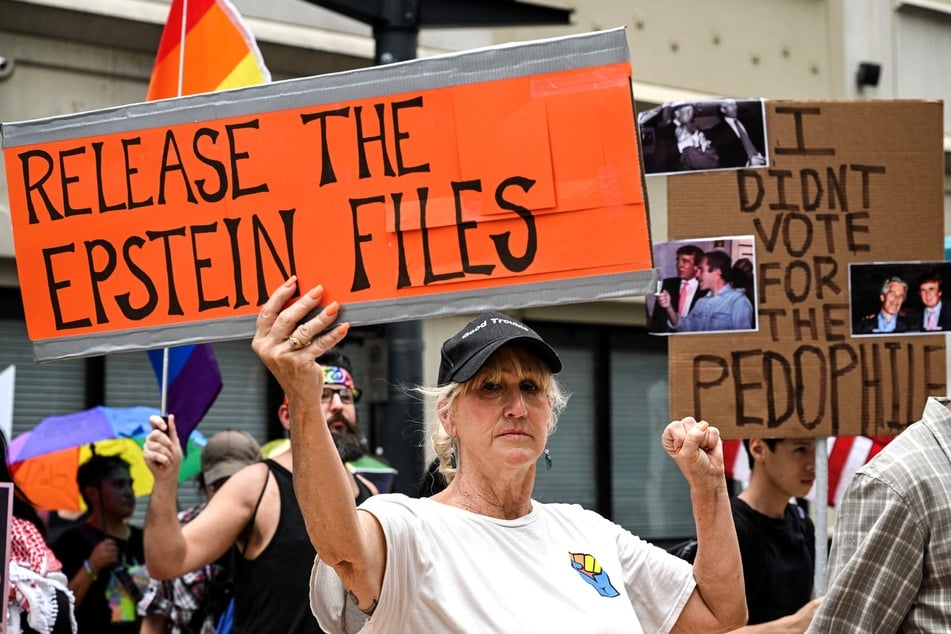 People hold signs calling for the release of files regarding late sex offender Jeffrey Epstein during a protest against the Trump administration in Houston, Texas, on July 17, 2025.