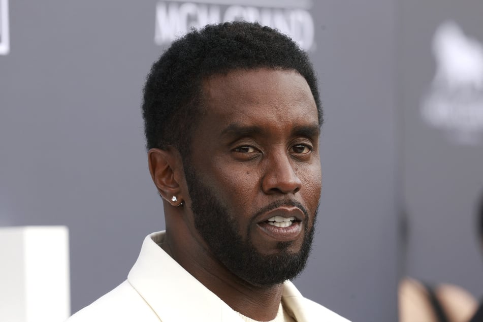 Sean "Diddy" Combs's legal team sought to cast doubt Thursday on a witness who claimed the hip-hop mogul dangled her off a balcony before throwing her onto furniture.