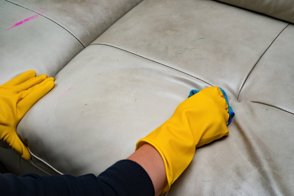 You can get stubborn stains out of a white leather couch through wet wipes, a curd soap, or a milk-water mixture.