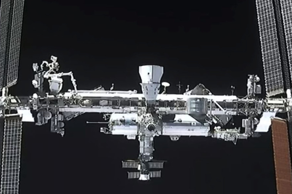 The ISS with one Dragon capsule already attached (top, center) before the Crew-2 capsule arrival.