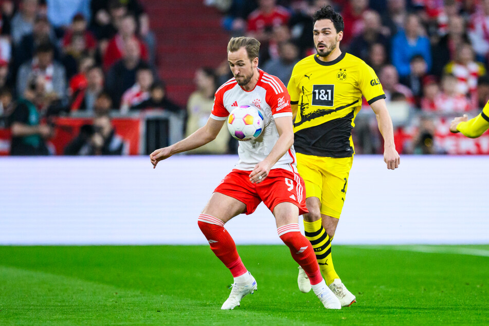 Harry Kane (l.) in Aktion gegen Dortmunds Mats Hummels (r.).