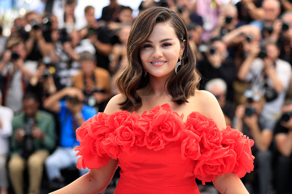 Selena Gomez stunned in a red gown for a photocall at the 2024 Cannes Film Festival on Sunday.