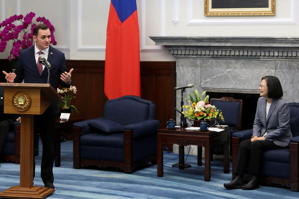 US Representative Mike Gallagher (l.) speaks during a meeting with Taiwan President Tsai Ing-wen at the presidential palace in Taipei.