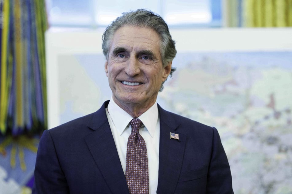 US Secretary of the Interior Doug Burgum speak to the media during an executive order signing event regarding Alaskan mining in the Oval Office of the White House on October 6, 2025.
