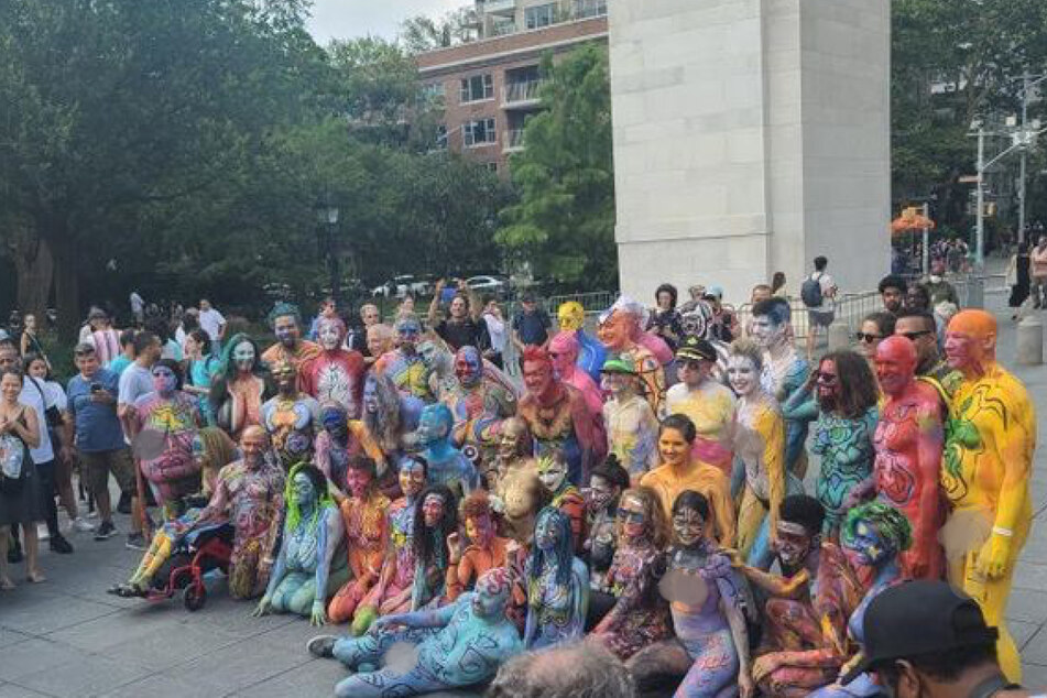 This year's bodypainting models posed in front of the Washington Square Park arch following a downtown march directly after the event.
