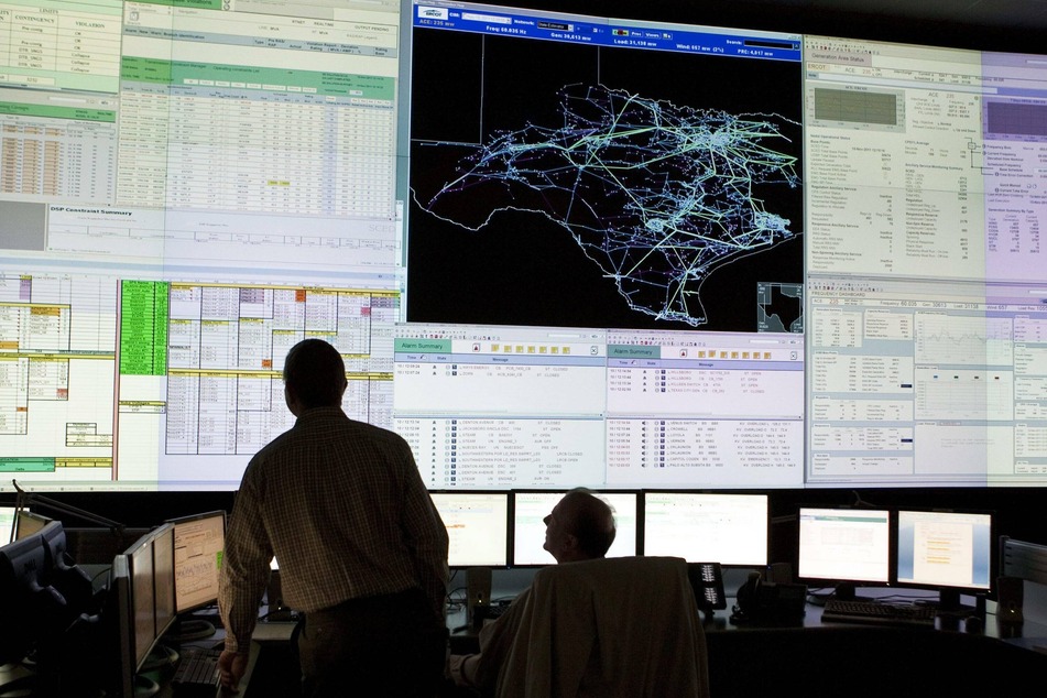 Workers monitored the Texas electric power grid at the ERCOT Electric Reliability Council of Texas facility.